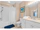Bathroom featuring a shower-tub combo, white vanity, and neutral tile floors at 2952 Lucayan Harbour Cir # 105, Kissimmee, FL 34746