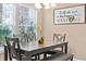 Bright dining area with natural light, modern decor, and comfortable seating for Gathering meals at 2952 Lucayan Harbour Cir # 105, Kissimmee, FL 34746