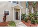 Inviting home exterior with a covered front entrance and mature landscaping at 2952 Lucayan Harbour Cir # 105, Kissimmee, FL 34746