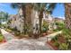 Charming exterior elevation showcasing lush landscaping, manicured walkways, and a welcoming facade at 2952 Lucayan Harbour Cir # 105, Kissimmee, FL 34746