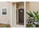 Inviting front entrance with a stylish door, decorative accents, and well-maintained landscaping at 2952 Lucayan Harbour Cir # 105, Kissimmee, FL 34746