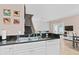 Kitchen with stainless steel appliances and a breakfast bar overlooking the living room at 2952 Lucayan Harbour Cir # 105, Kissimmee, FL 34746