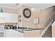 Eat-in kitchen with stainless steel appliances and a breakfast bar next to the stairs at 2952 Lucayan Harbour Cir # 105, Kissimmee, FL 34746