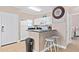 Efficient kitchen featuring a breakfast bar with sleek countertops and modern appliances at 2952 Lucayan Harbour Cir # 105, Kissimmee, FL 34746