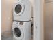 Laundry room with stacked washer and dryer and neutral walls at 2952 Lucayan Harbour Cir # 105, Kissimmee, FL 34746