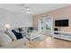 Comfortable living room with neutral tones, cozy seating, and glass doors leading to outdoor space at 2952 Lucayan Harbour Cir # 105, Kissimmee, FL 34746
