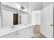 Bright bathroom featuring double sinks, large mirrors, and a walk-in shower at 3561 Conroy Rd # 216, Orlando, FL 32839
