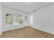 Bedroom featuring wood-look floors, natural light, and a sliding glass door at 3561 Conroy Rd # 216, Orlando, FL 32839