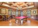 Upscale billiards room featuring a pool table, bar seating, and elegant decor at 3561 Conroy Rd # 216, Orlando, FL 32839