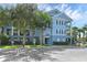 Three story blue condo building with a well maintained front lawn and parking area at 3561 Conroy Rd # 216, Orlando, FL 32839