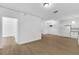 Open living area featuring wood-look floors connecting kitchen, dining, and living spaces at 3561 Conroy Rd # 216, Orlando, FL 32839
