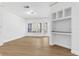Bright and airy living room with wood floors and neutral walls at 3561 Conroy Rd # 216, Orlando, FL 32839