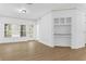Open-concept living room featuring wood floors and natural light at 3561 Conroy Rd # 216, Orlando, FL 32839