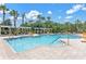 Resort-style pool area with pergolas, seating, and palm trees at 3561 Conroy Rd # 216, Orlando, FL 32839