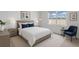 Cozy bedroom featuring neutral decor, a comfortable bed, and bright natural light from a large window at 3624 Sungrove Cir, Sanford, FL 32771