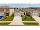 Well maintained single-Gathering home boasts a two-car garage, verdant landscaping, and manicured lawn at 3624 Sungrove Cir, Sanford, FL 32771