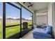 Screened patio featuring a comfortable couch, grill, and view of the backyard at 3624 Sungrove Cir, Sanford, FL 32771