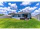 Spacious backyard with green lawn, patio, and outdoor seating, perfect for entertaining and relaxation at 3723 Alder Bark Ln, Sanford, FL 32773