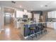 Modern kitchen featuring granite countertops, stainless steel appliances, and a center island with seating at 3723 Alder Bark Ln, Sanford, FL 32773