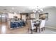 Spacious kitchen and dining area featuring an island, stainless appliances, and seating for comfortable meals at 3723 Alder Bark Ln, Sanford, FL 32773