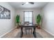 Home office featuring large plants, neutral walls, and a modern desk with chair at 3723 Alder Bark Ln, Sanford, FL 32773