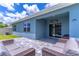 Covered patio featuring comfortable seating area and tile flooring. Welcome to our porch sign visible at 3723 Alder Bark Ln, Sanford, FL 32773