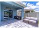 Covered patio featuring comfortable seating area and tile flooring. Welcome to our porch sign visible at 3723 Alder Bark Ln, Sanford, FL 32773