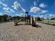 Community playground featuring a slide and climbing structure in a mulch-covered play area at 3723 Alder Bark Ln, Sanford, FL 32773