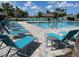 Resort-style community pool with plenty of lounge chairs and tables for relaxing by the water at 3723 Alder Bark Ln, Sanford, FL 32773