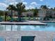 Community pool with multiple lounge chairs and seating areas for relaxation and recreation at 3723 Alder Bark Ln, Sanford, FL 32773