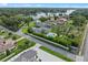 Overhead view of residential area with pools and manicured gardens near a picturesque lake setting at 3865 W Stillwood Ln, Lake Mary, FL 32746