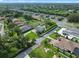 Overhead view of homes with pools, green lawns, and mature trees in a desirable neighborhood at 3865 W Stillwood Ln, Lake Mary, FL 32746
