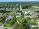 Aerial image of well-maintained homes with spacious yards, close to a roadway and green spaces at 3865 W Stillwood Ln, Lake Mary, FL 32746