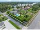 Gorgeous aerial view with a private pool and manicured gardens near a picturesque lake setting at 3865 W Stillwood Ln, Lake Mary, FL 32746