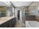 Bathroom featuring a soaking tub and a glass shower at 3865 W Stillwood Ln, Lake Mary, FL 32746
