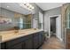 Bathroom featuring double sinks and a glass shower at 3865 W Stillwood Ln, Lake Mary, FL 32746