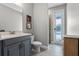 Bathroom with gray vanity and drawers, walk-in shower, and tiled floors at 3865 W Stillwood Ln, Lake Mary, FL 32746