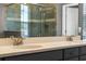 Close up of bathroom double sink and vanity with granite countertop at 3865 W Stillwood Ln, Lake Mary, FL 32746