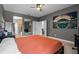 Bedroom featuring an en-suite bathroom and a view of the stadium at 3865 W Stillwood Ln, Lake Mary, FL 32746
