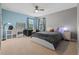 Bright bedroom featuring a ceiling fan, large window and black desk at 3865 W Stillwood Ln, Lake Mary, FL 32746