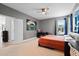 Bedroom with ample space, including a desk, large window, and neutral walls at 3865 W Stillwood Ln, Lake Mary, FL 32746