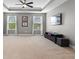 Large bonus room with bright natural light, neutral carpet, and a ceiling fan at 3865 W Stillwood Ln, Lake Mary, FL 32746