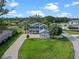 Beautiful two-story home with blue siding, a well-manicured lawn, and a charming yellow front door at 3865 W Stillwood Ln, Lake Mary, FL 32746