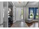 Foyer with tiled flooring and a view into the adjacent room with hardwood at 3865 W Stillwood Ln, Lake Mary, FL 32746