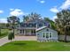 Charming two-story home with a well-manicured lawn and inviting front porch at 3865 W Stillwood Ln, Lake Mary, FL 32746