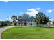 Beautiful two-story home with manicured lawn, blue facade, and a charming yellow front door at 3865 W Stillwood Ln, Lake Mary, FL 32746