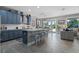 Modern kitchen with a large island, stainless steel appliances, and a breakfast bar at 3865 W Stillwood Ln, Lake Mary, FL 32746