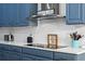 Close-up showcases modern white countertops, mosaic tile backsplash, and contemporary appliances at 3865 W Stillwood Ln, Lake Mary, FL 32746