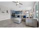 Open-concept living room and kitchen area with modern furnishings and natural light at 3865 W Stillwood Ln, Lake Mary, FL 32746
