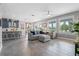 Open-concept living room flows into a modern kitchen, creating an inviting and functional living space at 3865 W Stillwood Ln, Lake Mary, FL 32746